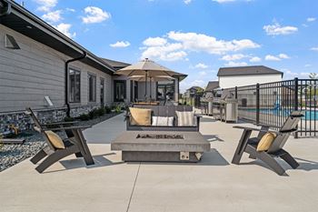 the estates at tanglewood  outdoor patio area with fire pit and seating area